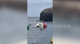 Moment unlucky tourists sink their rental boat