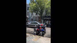 Car rips off muffler after hitting raised sewer in Brooklyn, New York