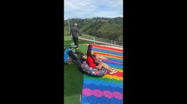 Tourist loses her shoes taking on this wild rainbow slide in Thailand