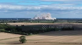 Drone footage: UK power station's 8 cooling towers demolished in sync