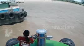 Boat crew rescues couple struggling to stay afloat in Bangkok river