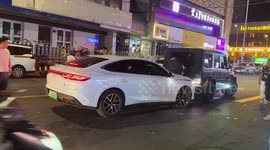 Cars stuck together fail to separate as bystanders watch in Gansu, China