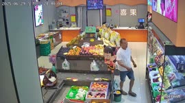 Man startled by cartoon character balloon while covering chiller in Henan, China