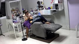 Sofa topples over backwards as customer has beauty treatment