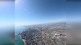 Army parachute team fly American flag over Chicago