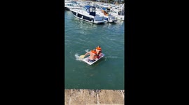 Bathtub rafts nearly collide during sea adventure in Sarzeau, France