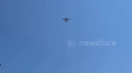 Hunger-stricken Palestinians rush to air-dropped aid in central Gaza as some tents collapse under falling parcels