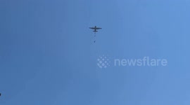 Hunger-stricken Palestinians rush to air-dropped aid in central Gaza as some tents collapse under falling parcels