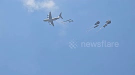 Palestinians rush to airdropped aid amid starvation in Gaza