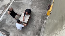Elderly men engrossed in chess game despite rain pouring around them