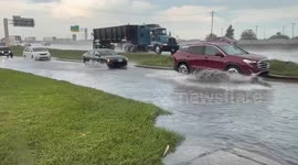 US: Flooded Feeder Roads Create Hazardous Driving In Houston