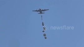 Palestinians rush for aid parcels airdropped over Gaza