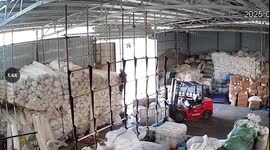 Terrifying moment worker buried under fabric after shelves collapse, colleagues battle to rescue him