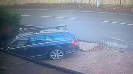 Man falls but quickly gets up and collects his items in a hurry