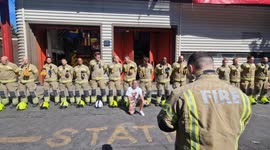 Firefighters mark a minute silence for the 72 victims who perished in the Grenfell fire during Notting Hill Carnival