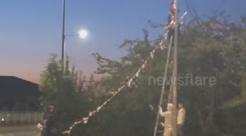 Harlow, United Kingdom – 08/25/2025 – A group of residents gathered along Southern Way in Harlow, Essex, at 8:00 PM to participate in 