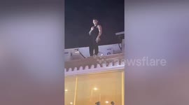 Drunk Brazilian tourist sparks chaos climbing massage shop roof in Phuket nightlife spot