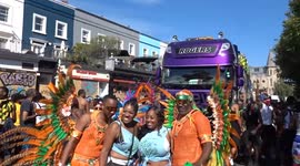 Notting Hill Carnival 2025 - photo session with hot male dancers in orange costumes