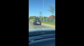 Car with air mattress tied on roof in fast pace in Columbus, Ohio