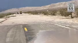 Flash floods cover desert highway in California