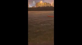 An Elderly Boating in Heavy Rainstorm