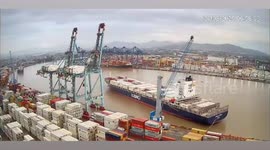 Emergency tugboats speed to stop disaster after massive vessel breaks free in fast-flowing river