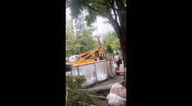 Ladder truck loses balance before falling onto playground