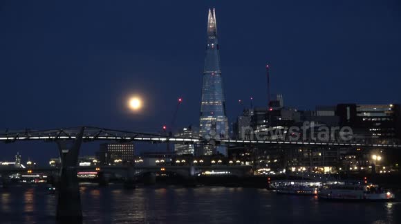 The September Full Moon, known as the Corn Moon, is seen rising in the skies of London as it passes the Shard