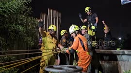 Pedestrian rescued after falling into 15-metre deep wastewater pit in Bangkok