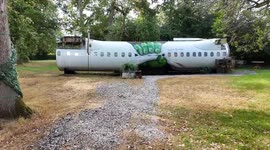 Britain's quirkiest Airbnb is a 'crashed plane' split in two in the woods