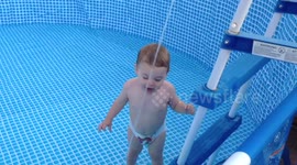 Hilarious! Kid has fun filling pool with gardenhose