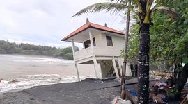 Beach house in Bali collapses as heavy rain and floods kill at least six people
