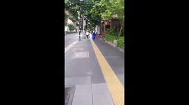 Family of Japanese tourists seen cleaning up rubbish from footpath in Bangkok
