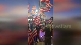 Charlie Kirk vigil held on Huntington Beach with American flags