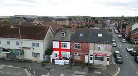 Dad who had England flag torn down paints giant St George's cross on front of home