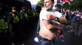 Tommy Robinson supporter strips off to show police his large back tattoo of Winston Churchhill