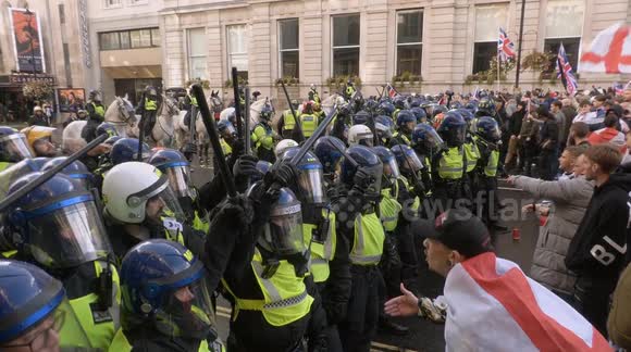 Friendly Fire! Man hit on the head by traffic cone hurled by fellow protester during CLASHES at Tommy Robinson demo