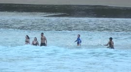 Daredevils Brave Gale Force Winds & Waves at Towan Beach, Cornwall, UK