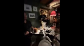 Waitress brings page less menu in Martha’s Vineyard, USA