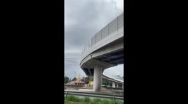 Cat stuck on motorway bridge rescued in Thailand