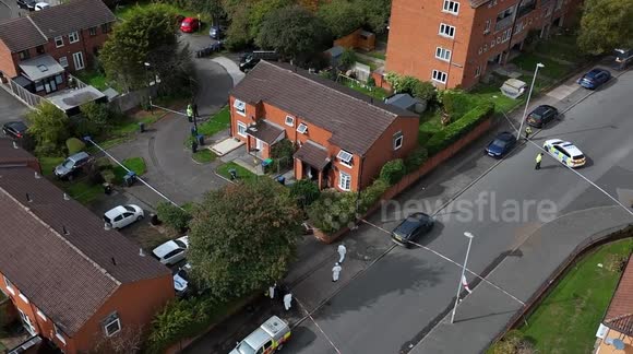 Police seal off road as murder investigation is launched following Birmingham house fire