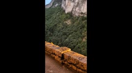 Precarious Walk On Picturesque Ledge