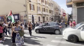 cars attempting to drive through free Palestine march in Cagliari