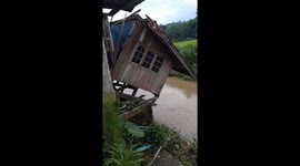 House collapses in canal after persistent rainfall