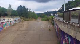 Storm waters rise in drainage canal of Arenys de Mar, Spain