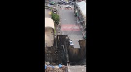 Huge sinkhole drags vehicles and electricity lines into abyss in Thailand