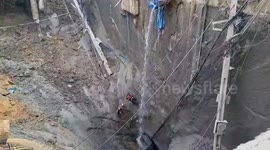 Workers make quick retreat from sinkhole as walls start to cave in