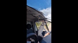 Dog enjoys car ride breeze in North Yorkshire, UK