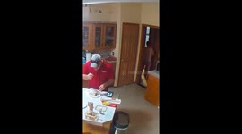 Little girl tries to hide spaghetti in Milltown, Wisconsin, USA