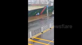 Moment mother and her children trapped under barricade toppled by Typhoon Ragasa winds are rescued by police and locals
